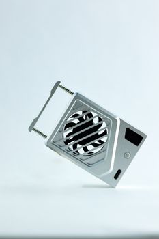 Minimalist photo of a floating computer heat sink against a clean white backdrop, suitable for tech websites.