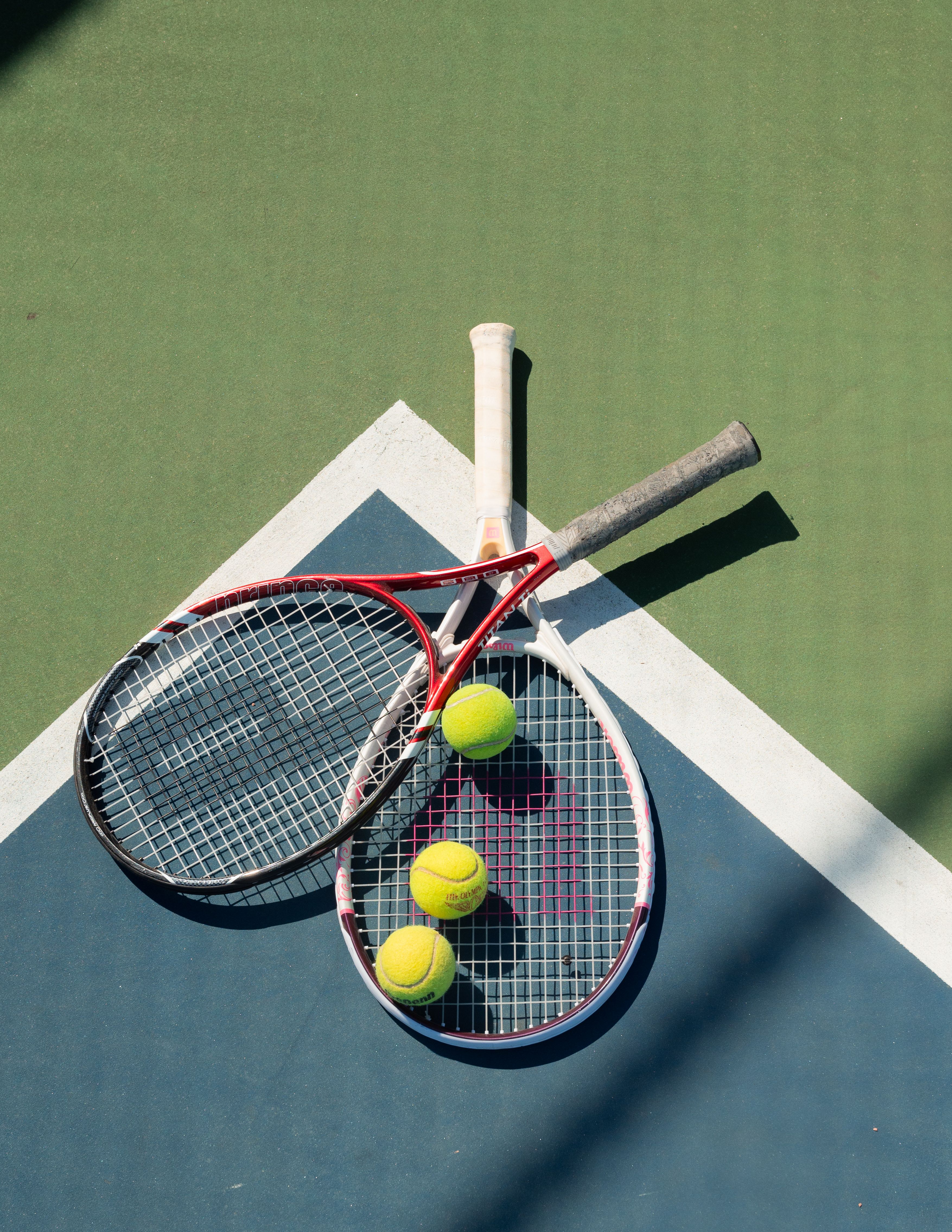 Tennis Rackets and Balls on Court · Free Stock Photo