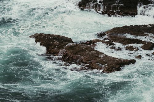 Free Dramatic waves crashing against rocky shores in Northern Ireland. Stock Photo