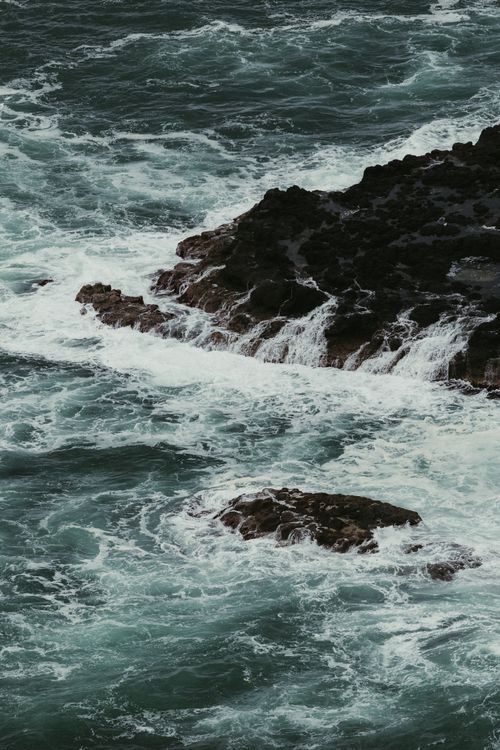 Free Dynamic waves crashing against rocky coastline in Northern Ireland, showcasing nature's raw power. Stock Photo