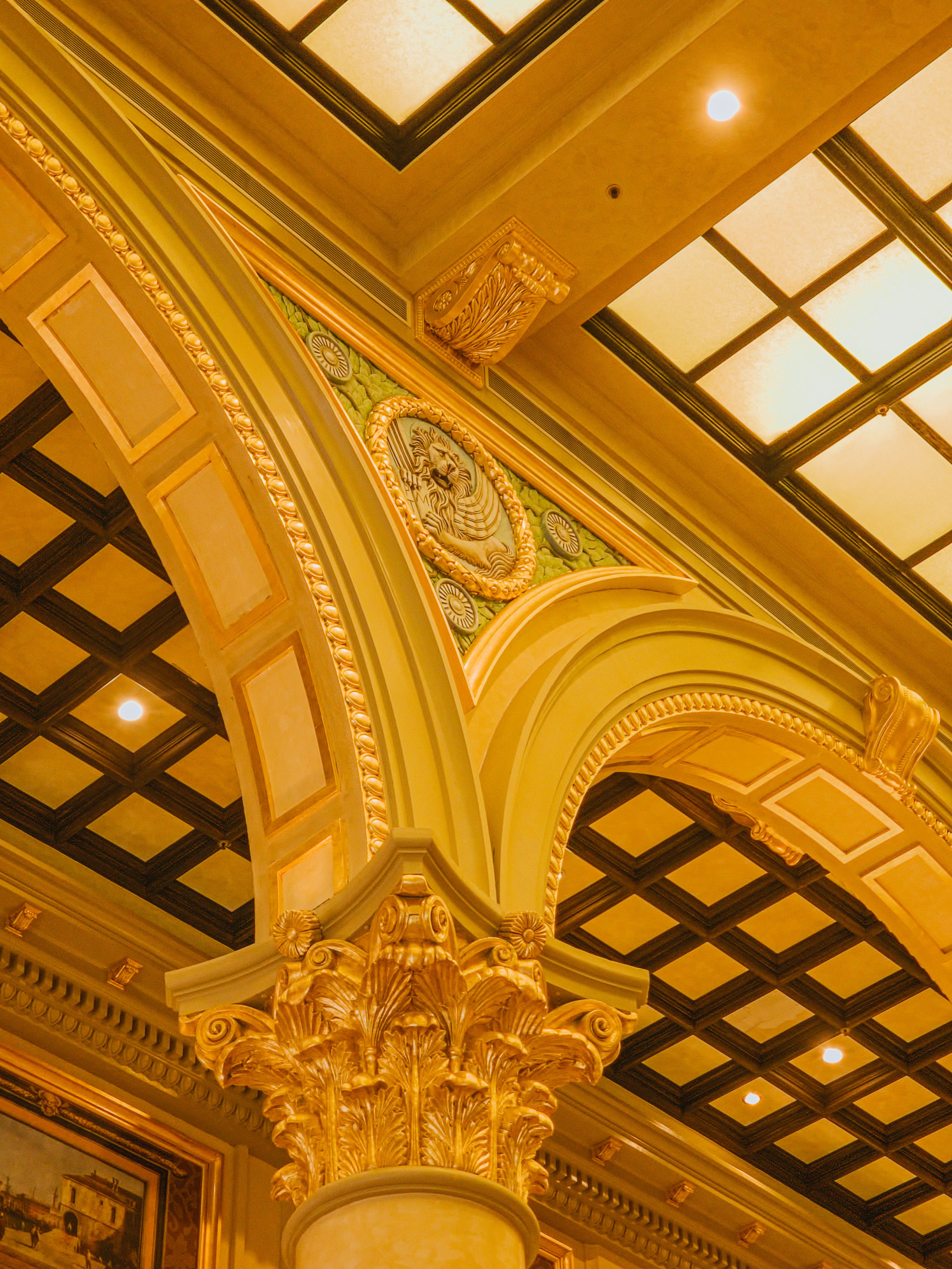 Intricate architectural elements of a casino ceiling in Macao capture a luxurious ambiance.
