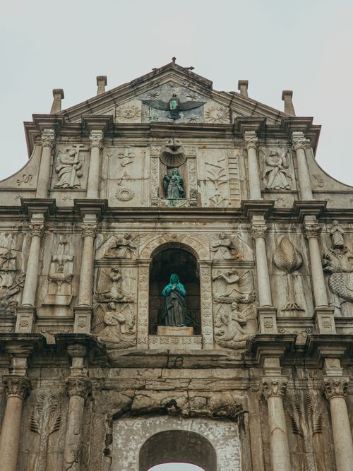 Free The iconic Ruins of St. Paul's facade in Macao, showcasing intricate stone carvings and historical architecture. Stock Photo