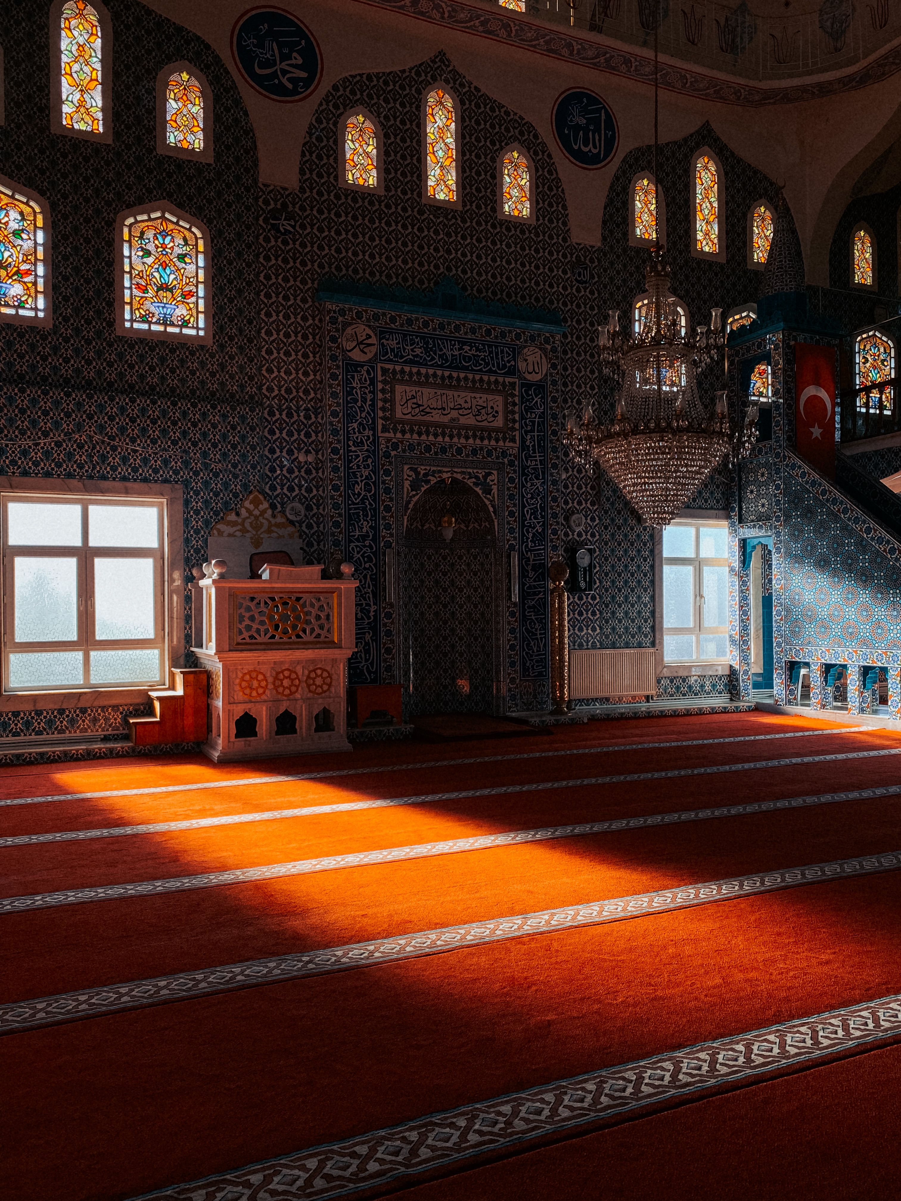 Serene Interior of a Turkish Mosque with Sunlight · Free Stock Photo