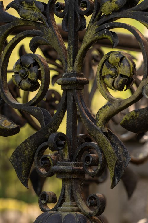 Free Close-up of ornate, moss-covered ironwork in Gārsene, Latvia, showcasing rustic elegance. Stock Photo