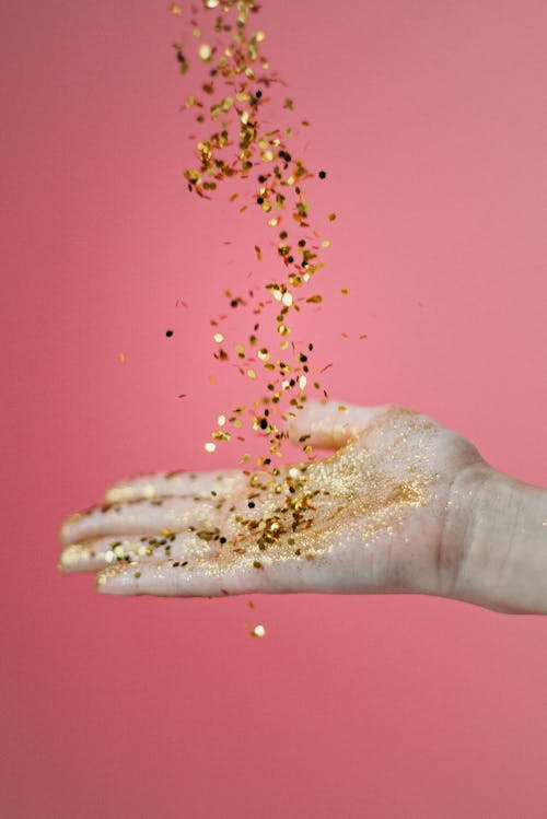 Free Person Catching Glitters Stock Photo