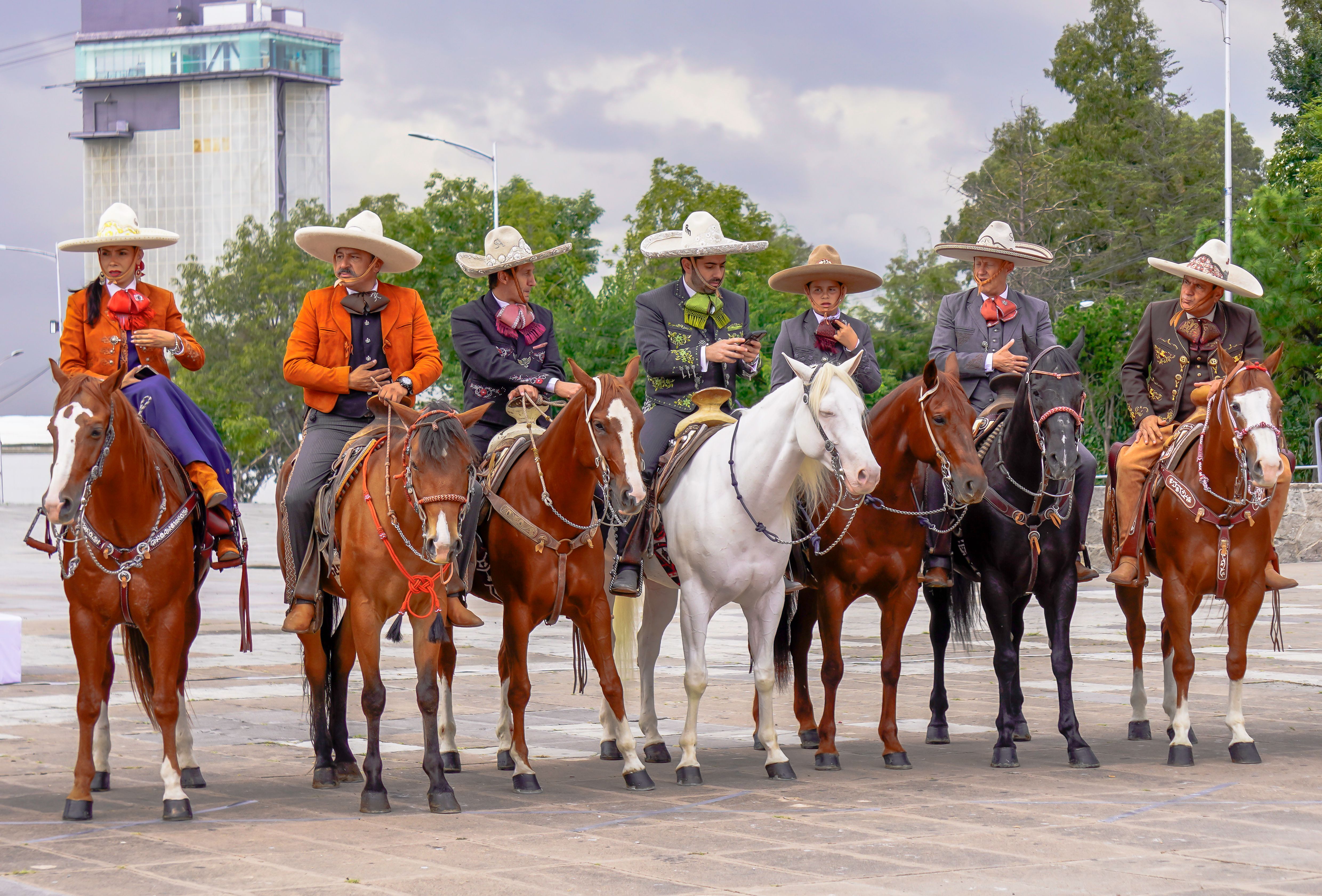 Mexican Charros Riding in Traditional Attire · Free Stock Photo