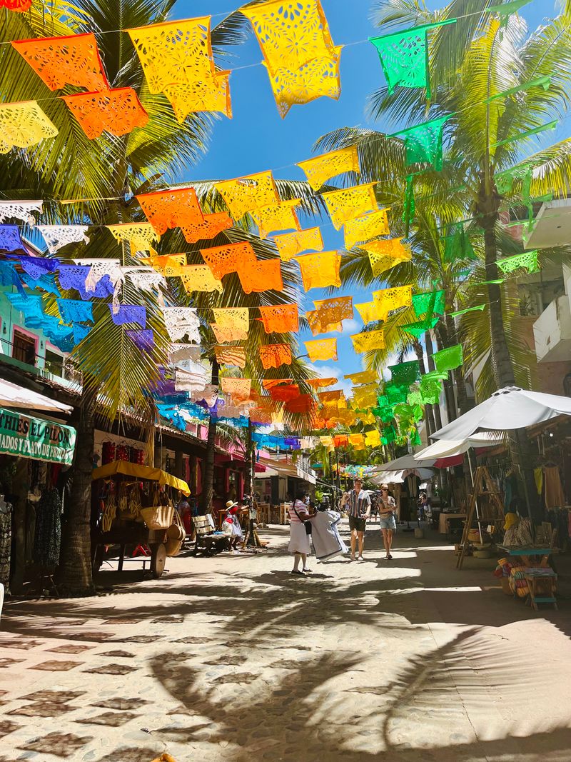 Papel picado over a Sayulita street