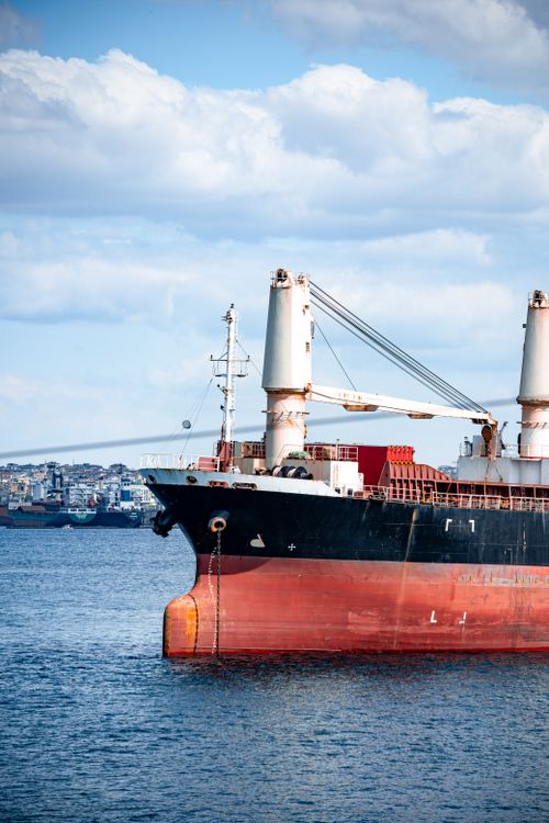 Free A large cargo ship sails on the Bosphorus under blue skies in İstanbul, Türkiye. Stock Photo