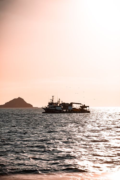 Free A tranquil boat at sunset on the waters near Istanbul captures serenity and beauty. Stock Photo