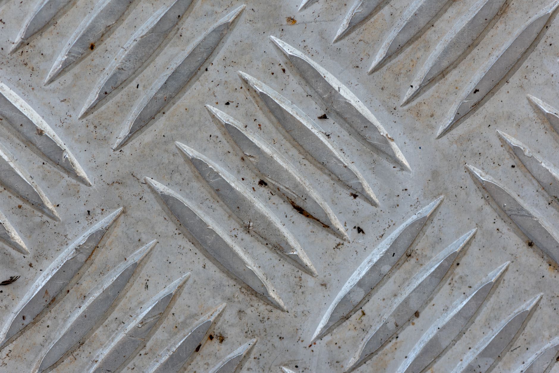 High-resolution image of a textured metal surface in Minas Gerais, Brazil, showing intricate patterns.
