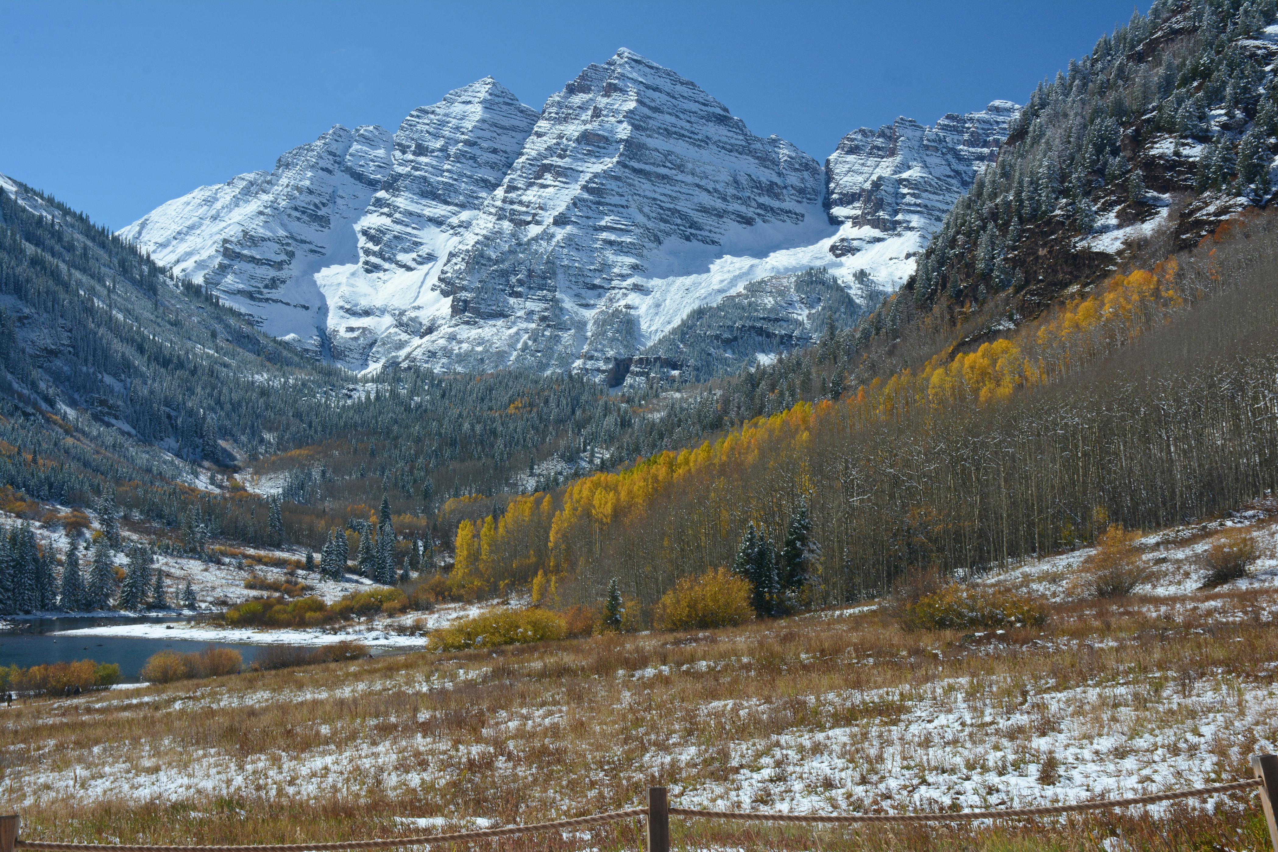Maroon Bells autumn landscape with aspen trees and snowy peaks