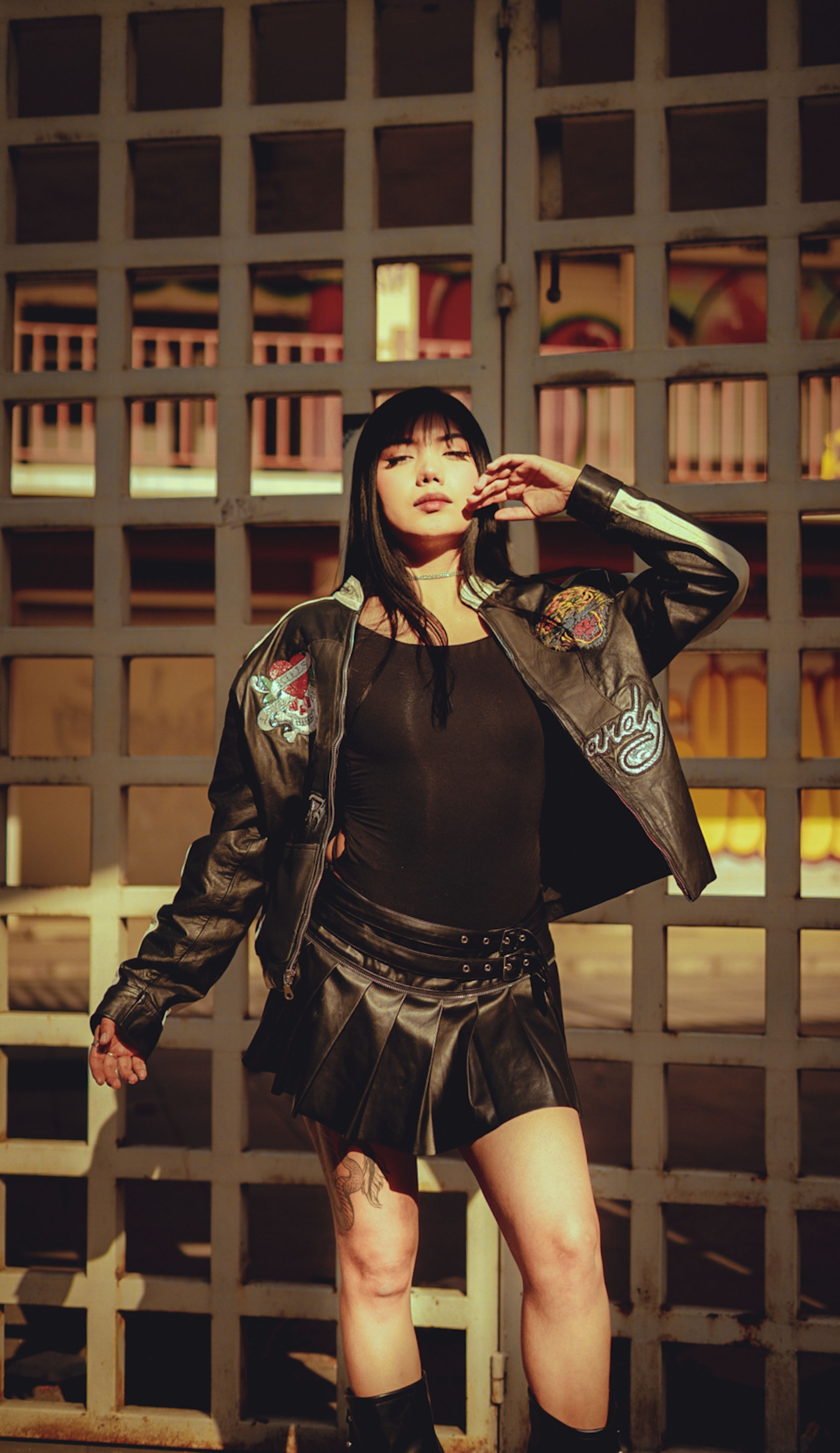 Stylish Woman in Leather Jacket Posing Outdoors · Free Stock Photo