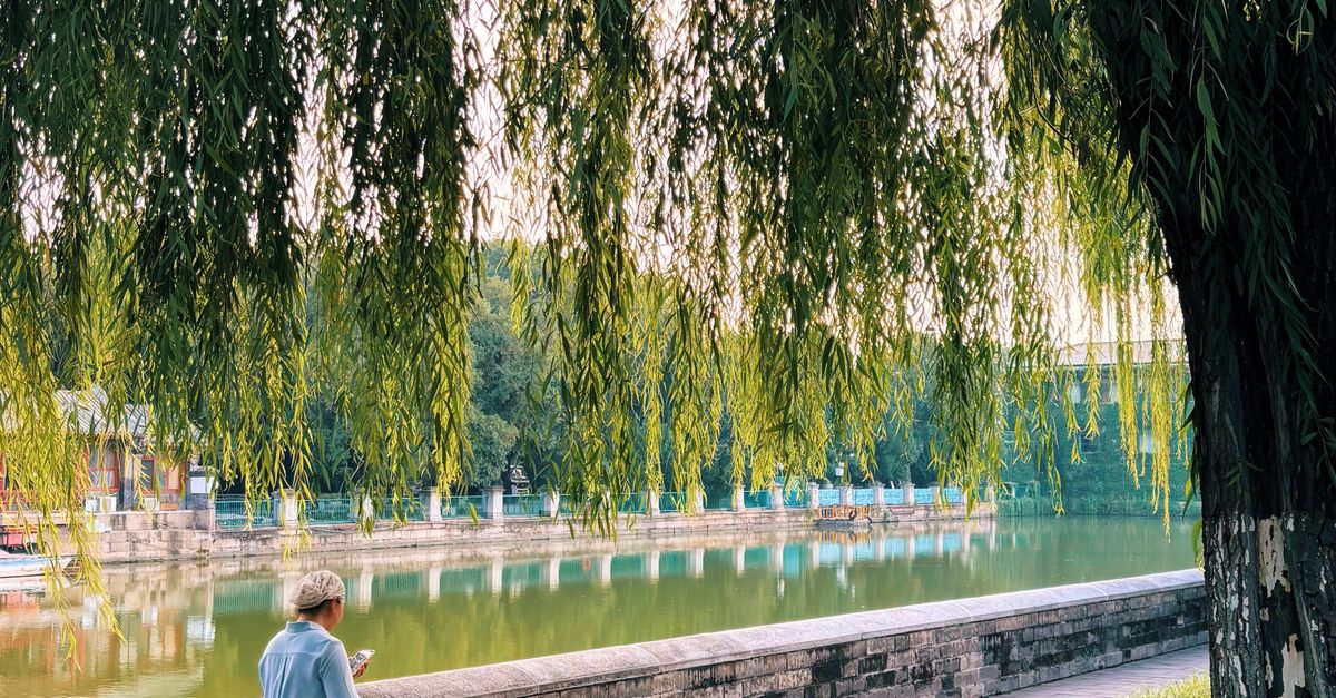 Peking Riverside Serene Riverside Walkway in Beijing · Free Stock Photo