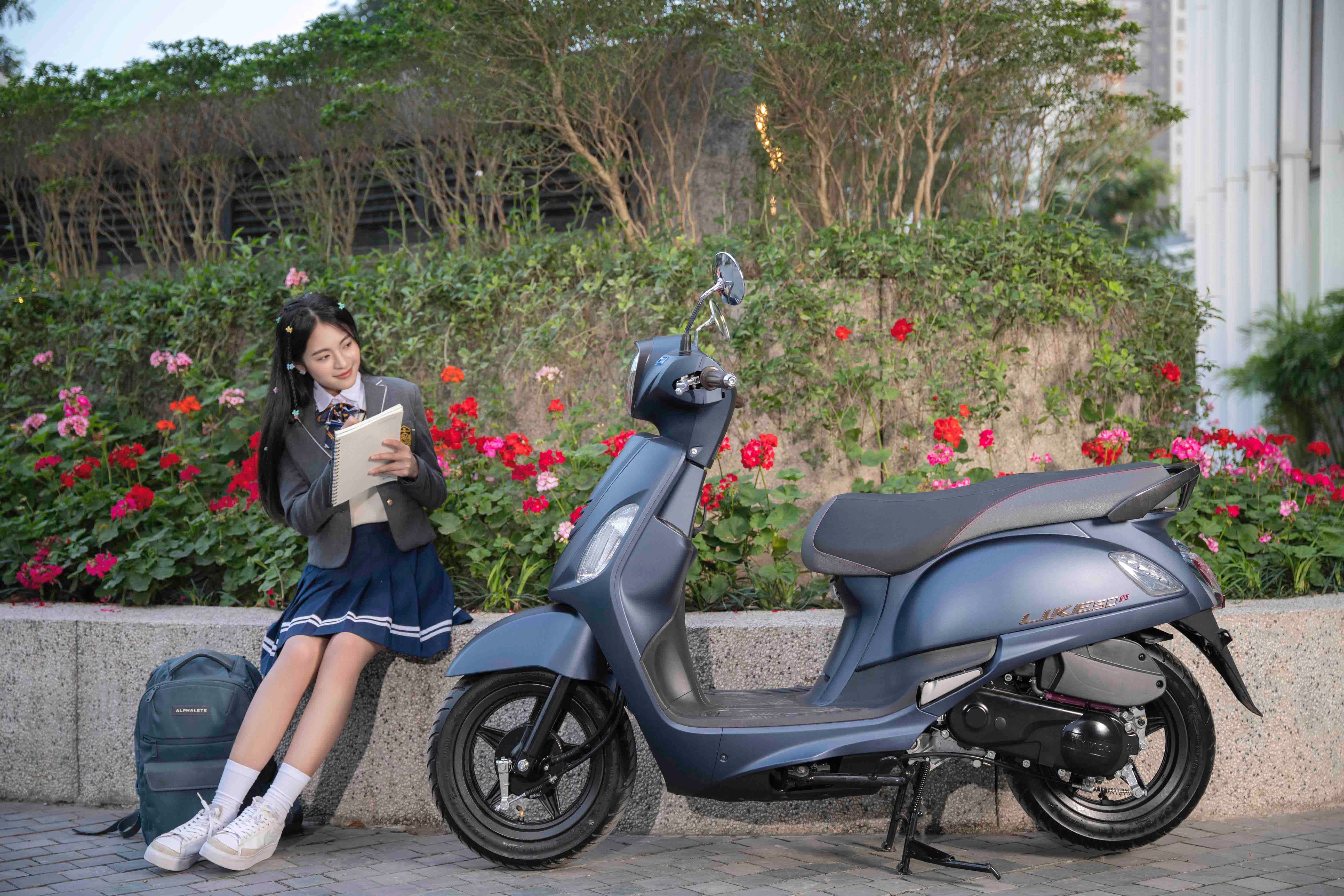 Student Relaxing by Scooter with Notebook · Free Stock Photo