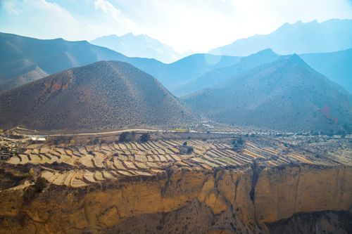 Free Explore the majestic terraced landscape of Lo Manthang in Nepal, showcasing its natural beauty. Stock Photo