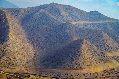 Free Breathtaking landscape of the arid hills in Upper Mustang, Nepal, under a clear sky. Stock Photo