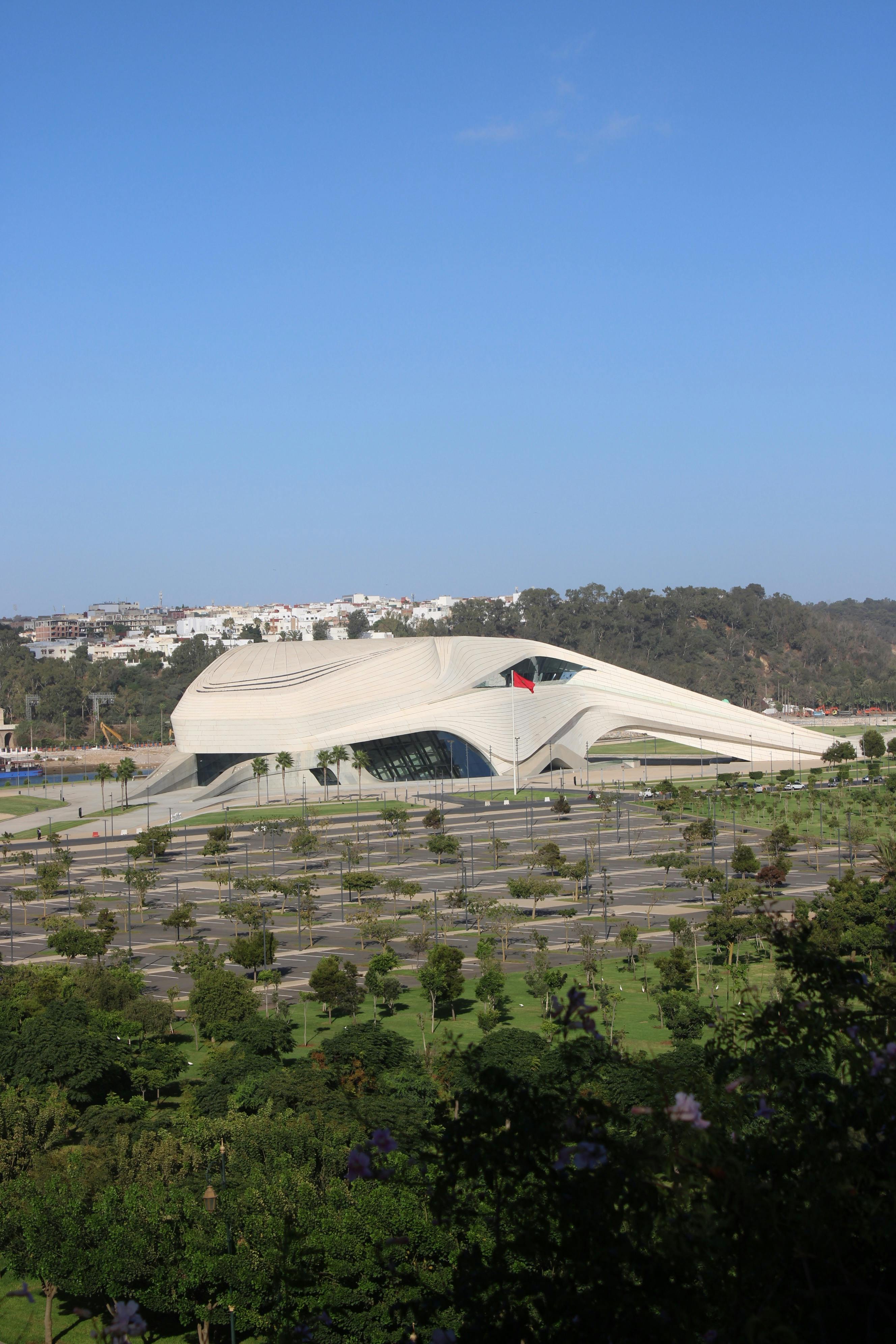 Free A modern architectural masterpiece of the Grand Theater in Rabat, Morocco under clear blue skies. Stock Photo
