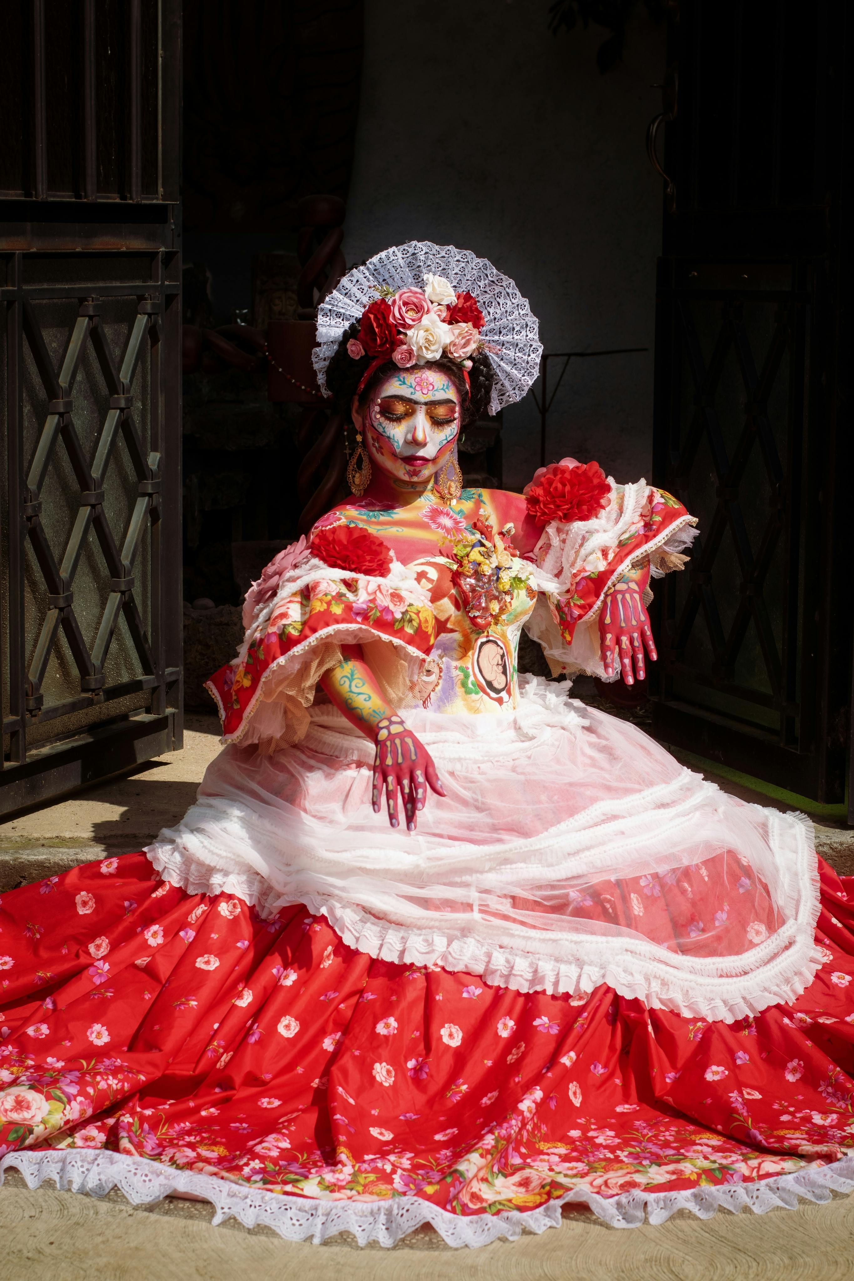 A colorful Catrina costume adorned with flowers, celebrating Day of the Dead in Mexico City.