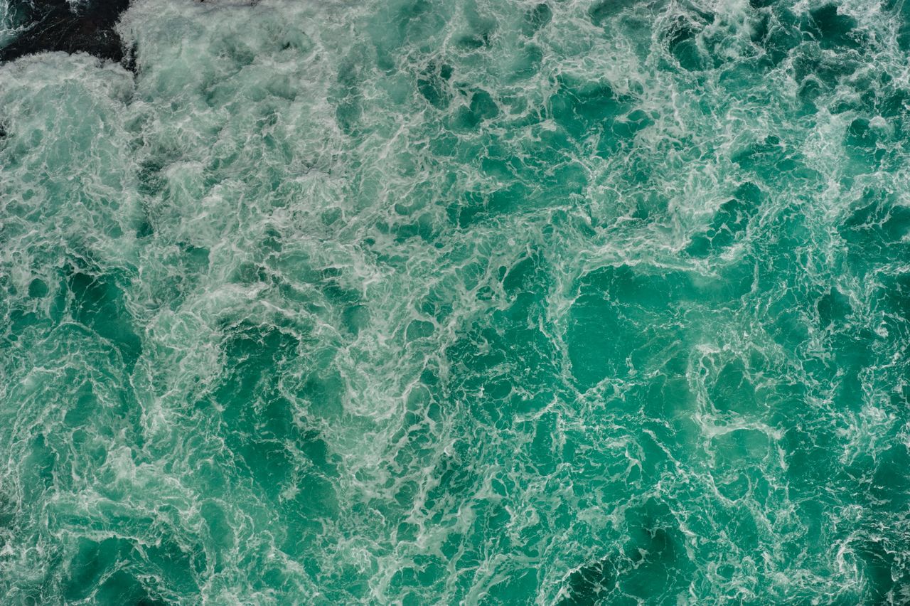 aerial shot of swirling turquoise waters in naruto tokushima japan cap
