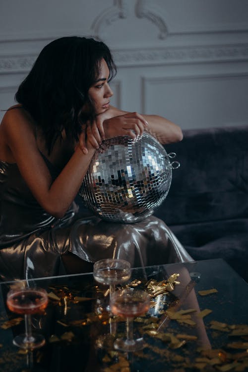 Woman Holding A Disco Ball