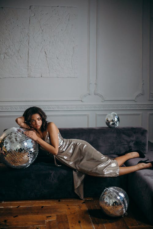 Woman Leaning on Mirror Ball