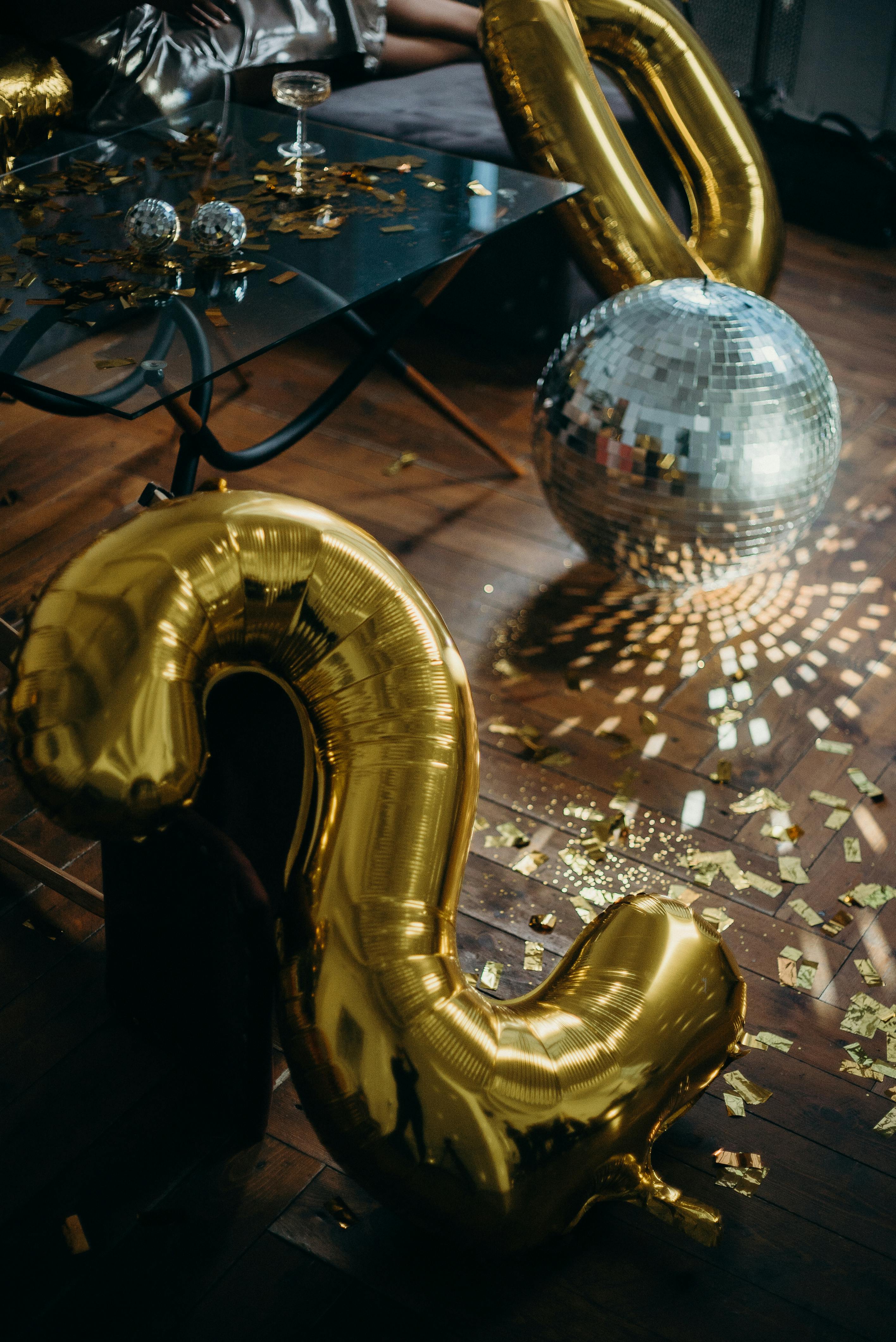 photo of disco ball on floor near numbers