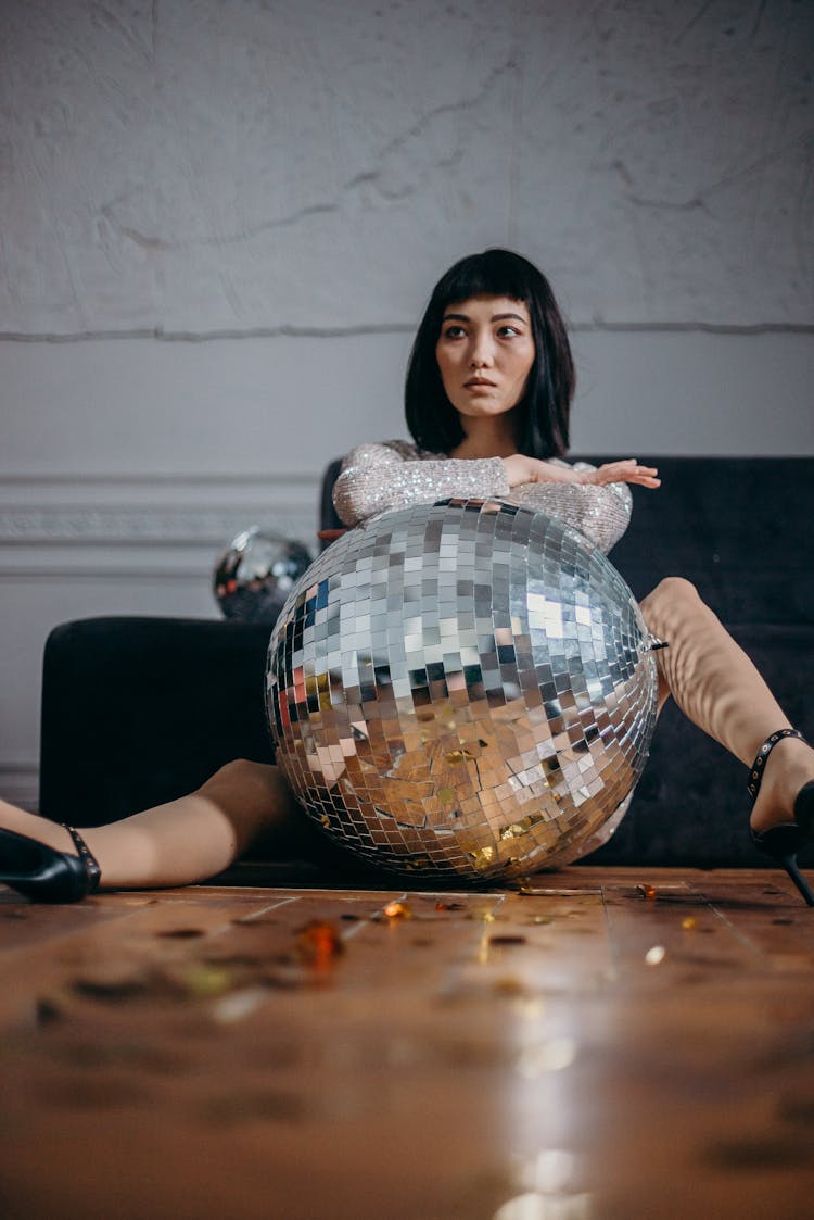 Low Angle Photo Of Woman Sitting On Floor