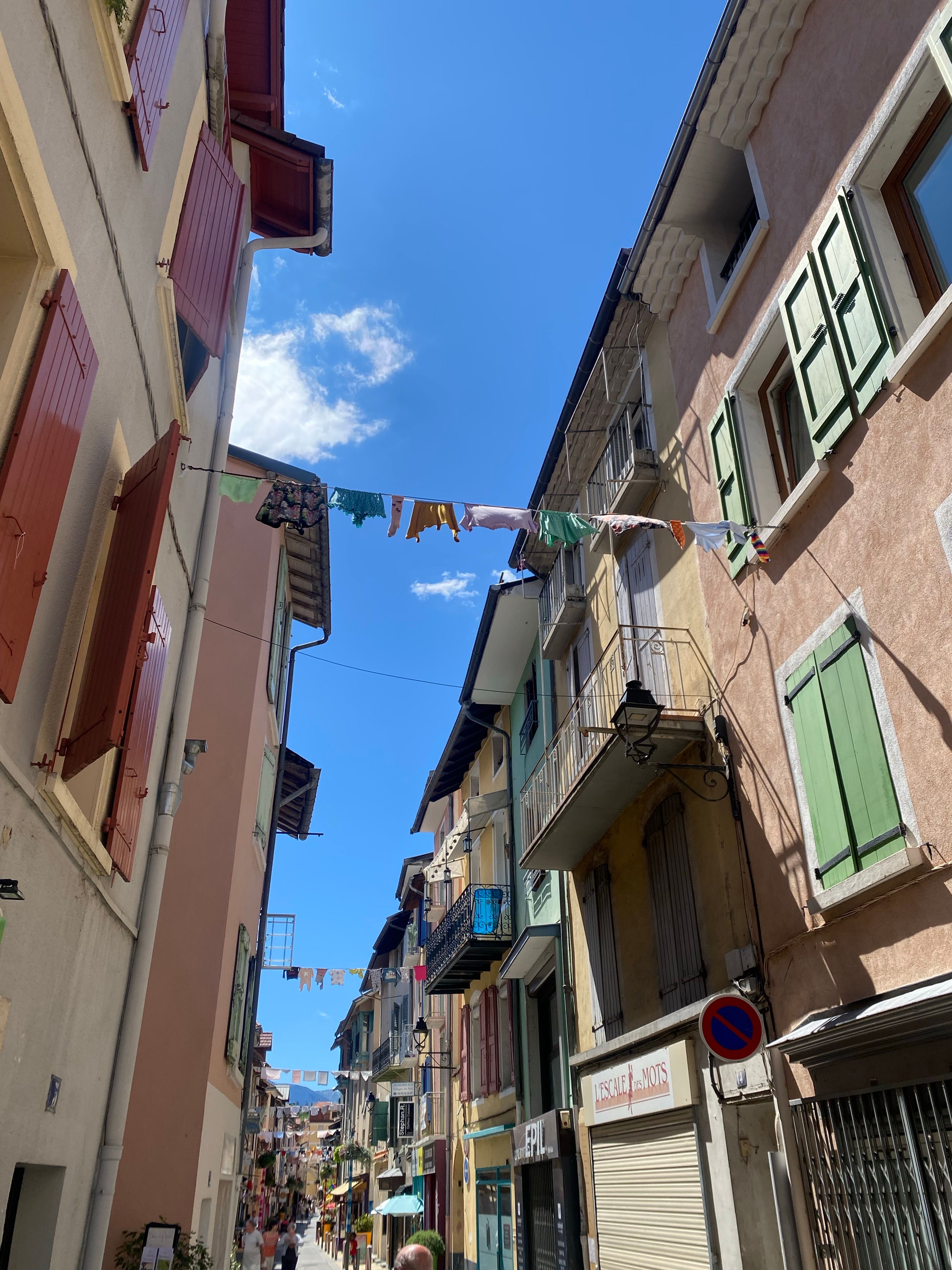 Charming European Alley with Colorful Windows · Free Stock Photo