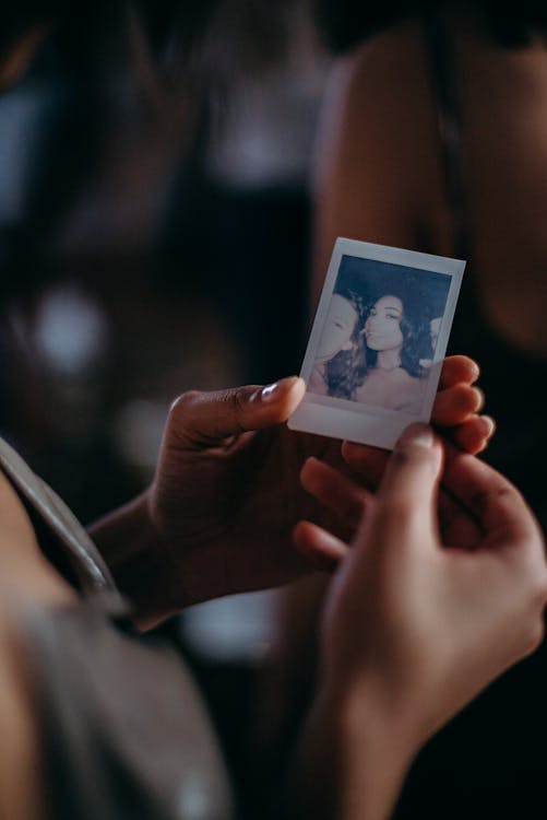 Free Person Holding Woman's Photo Stock Photo