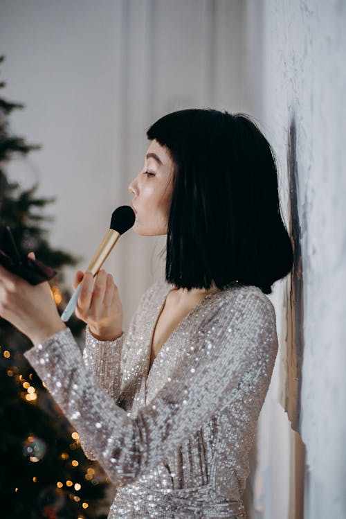 Free Woman Putting Makeup on Her Face Stock Photo