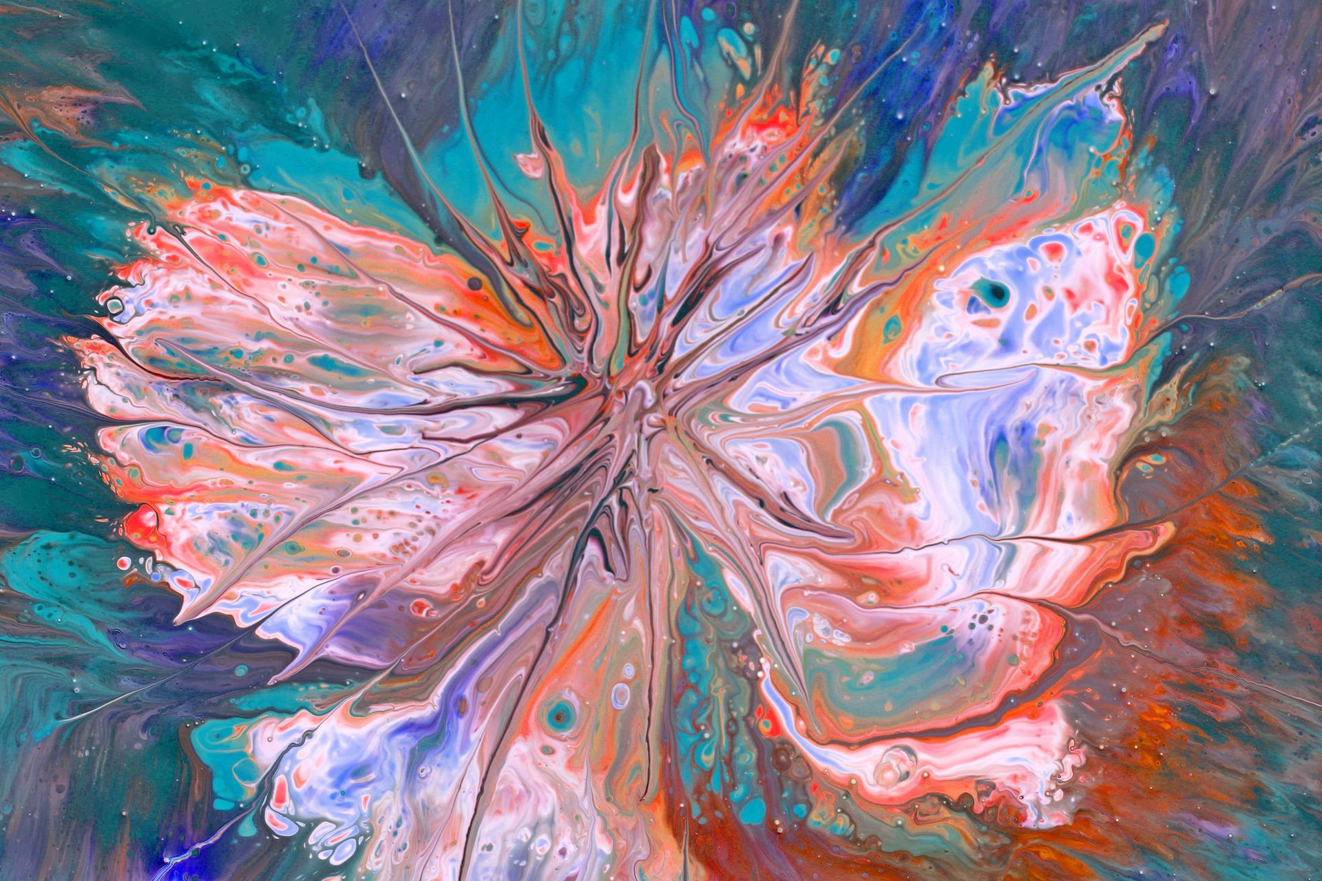 Acrylic pour painting capturing dynamic swirls of vibrant colors resembling an abstract flower in close-up view.