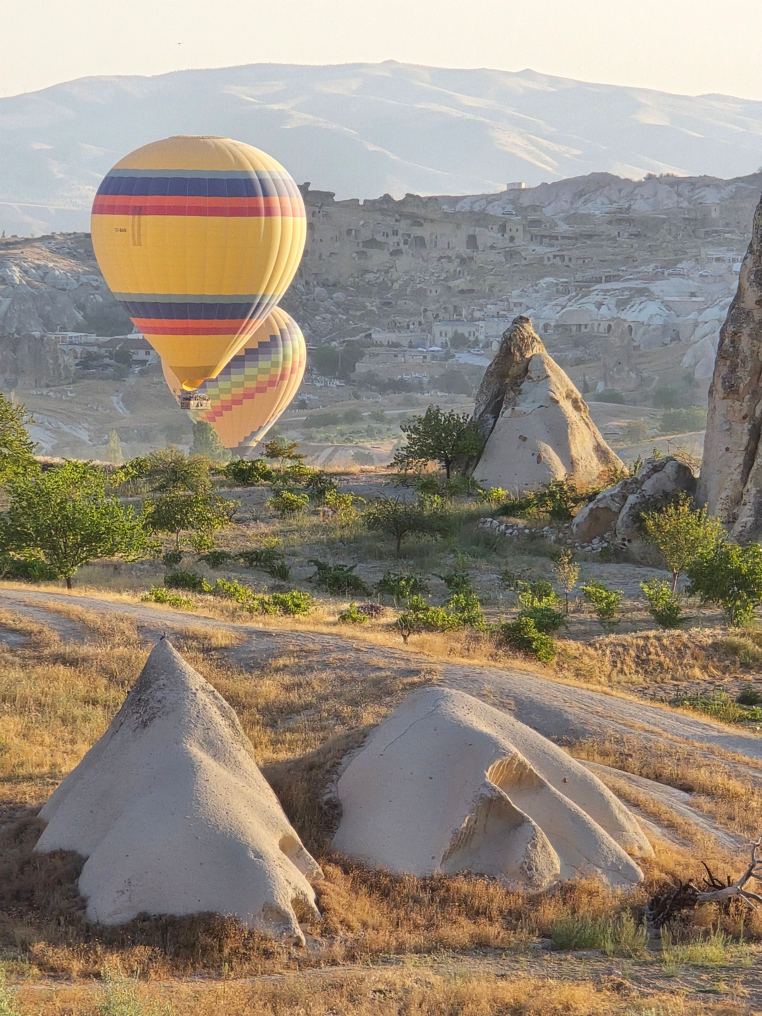 Stunning Hot Air Balloon Over Cappadocia Landscape · Free Stock Photo
