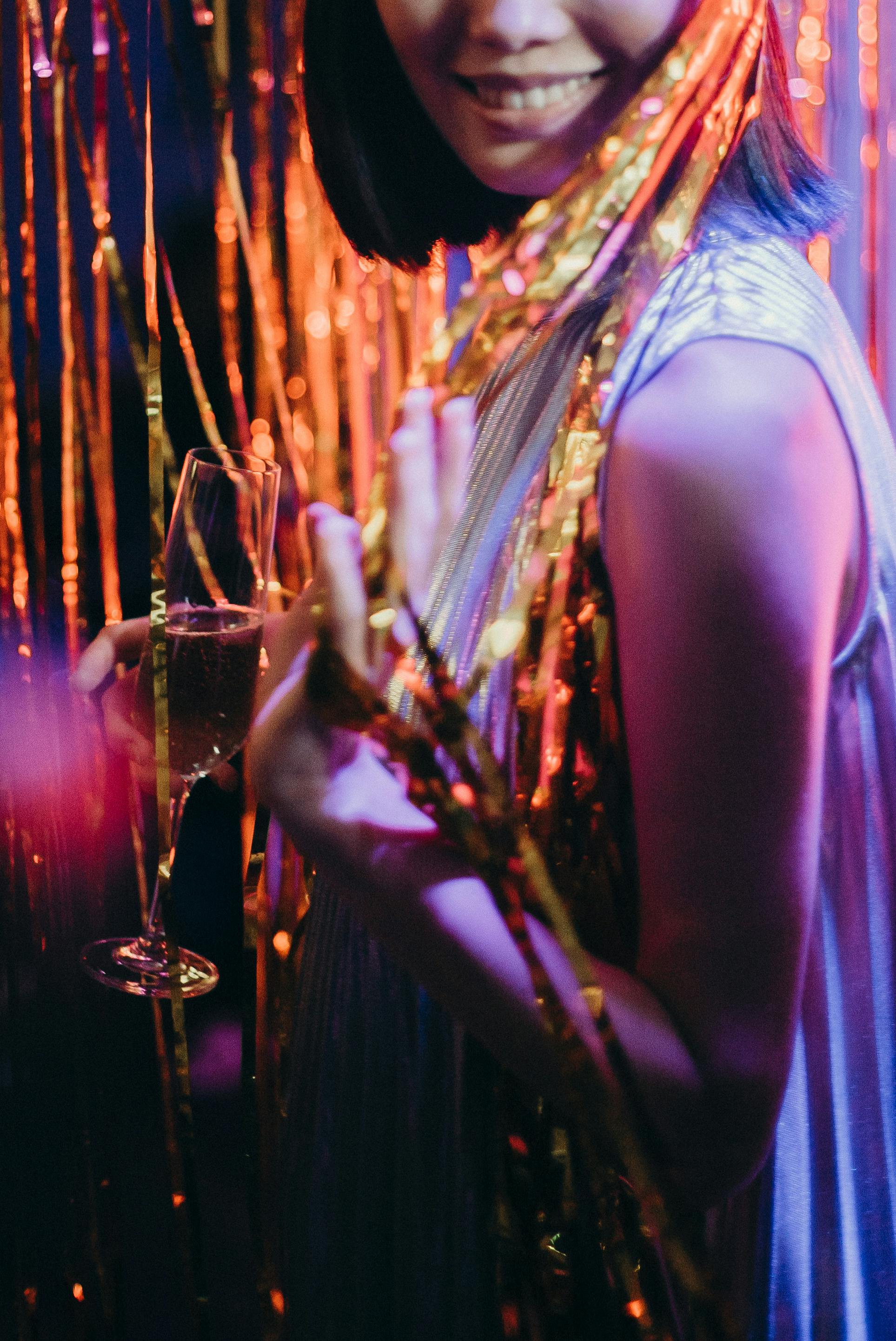 woman holding champagne glass