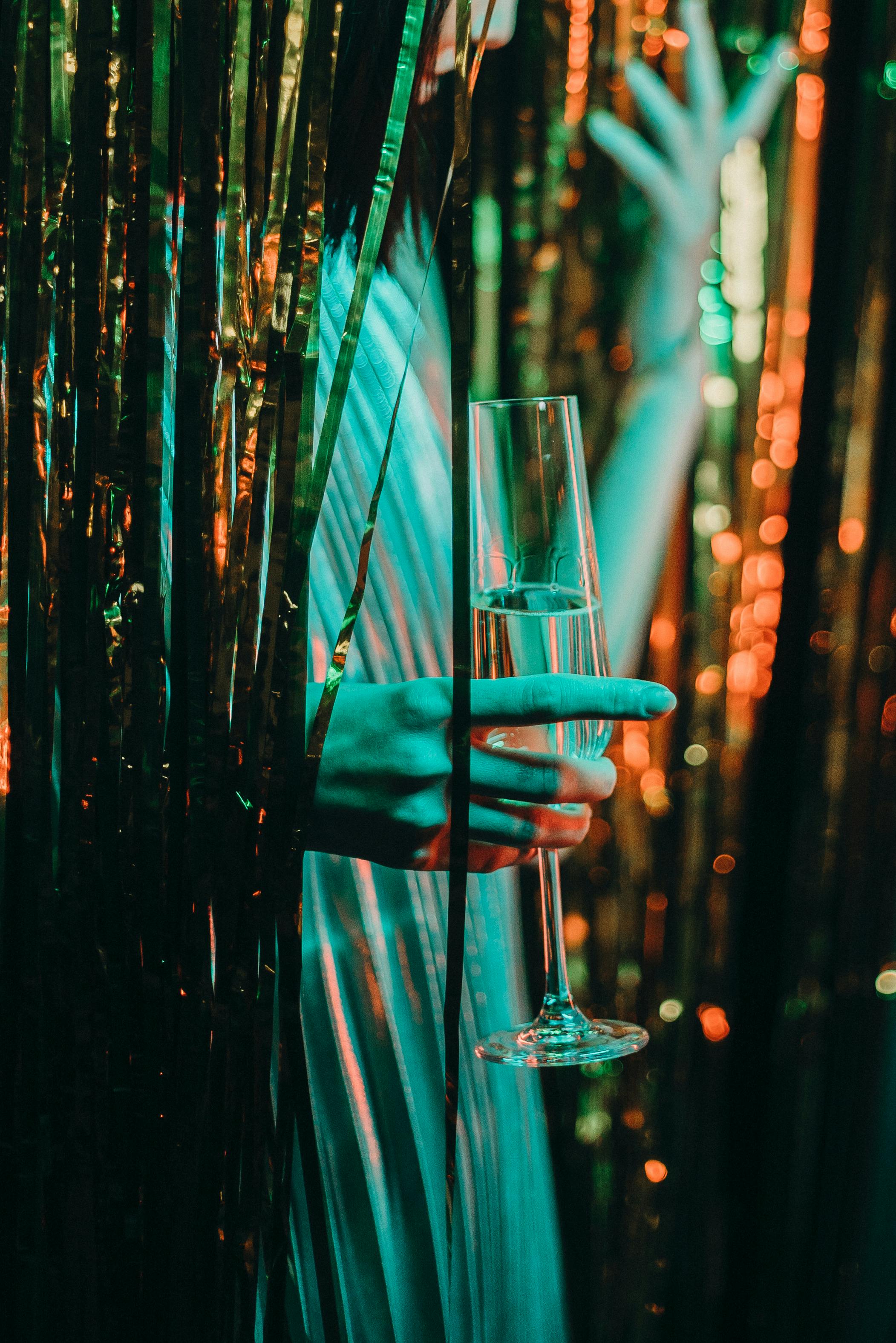 Woman Holding Champagne Flute · Free Stock Photo