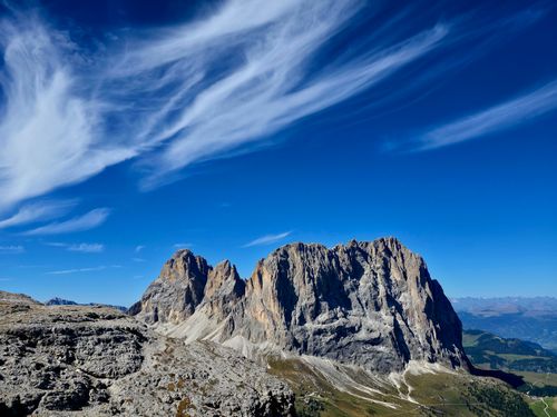 Free Scenic view of the Dolomite mountains with striking cloud formations against a vibrant blue sky. Stock Photo