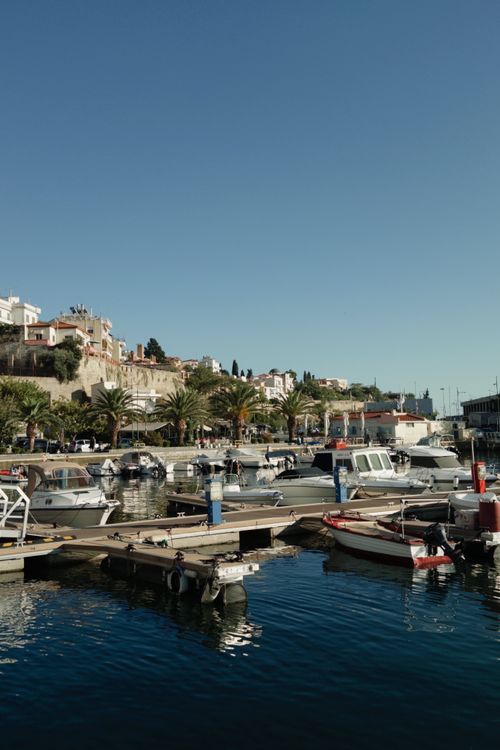 Free Serene marina with docked boats in Kavala, Greece, under a clear blue sky. Stock Photo