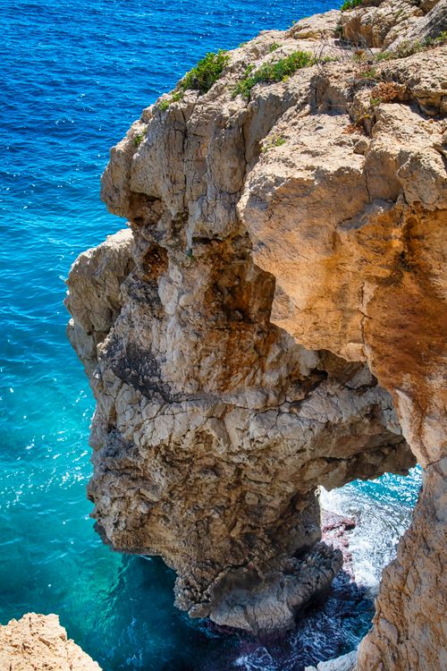 Free Stunning sea cliffs under a bright blue sky in Benitachell, Comunidad Valenciana, España. Stock Photo