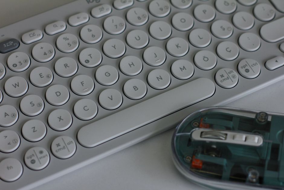 Ergonomic tools and tech gadgets on a clean desk - Remote work gifts