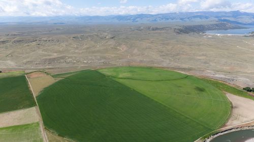 Free Stunning aerial view of expansive farming fields with circular irrigation in a rural landscape. Stock Photo