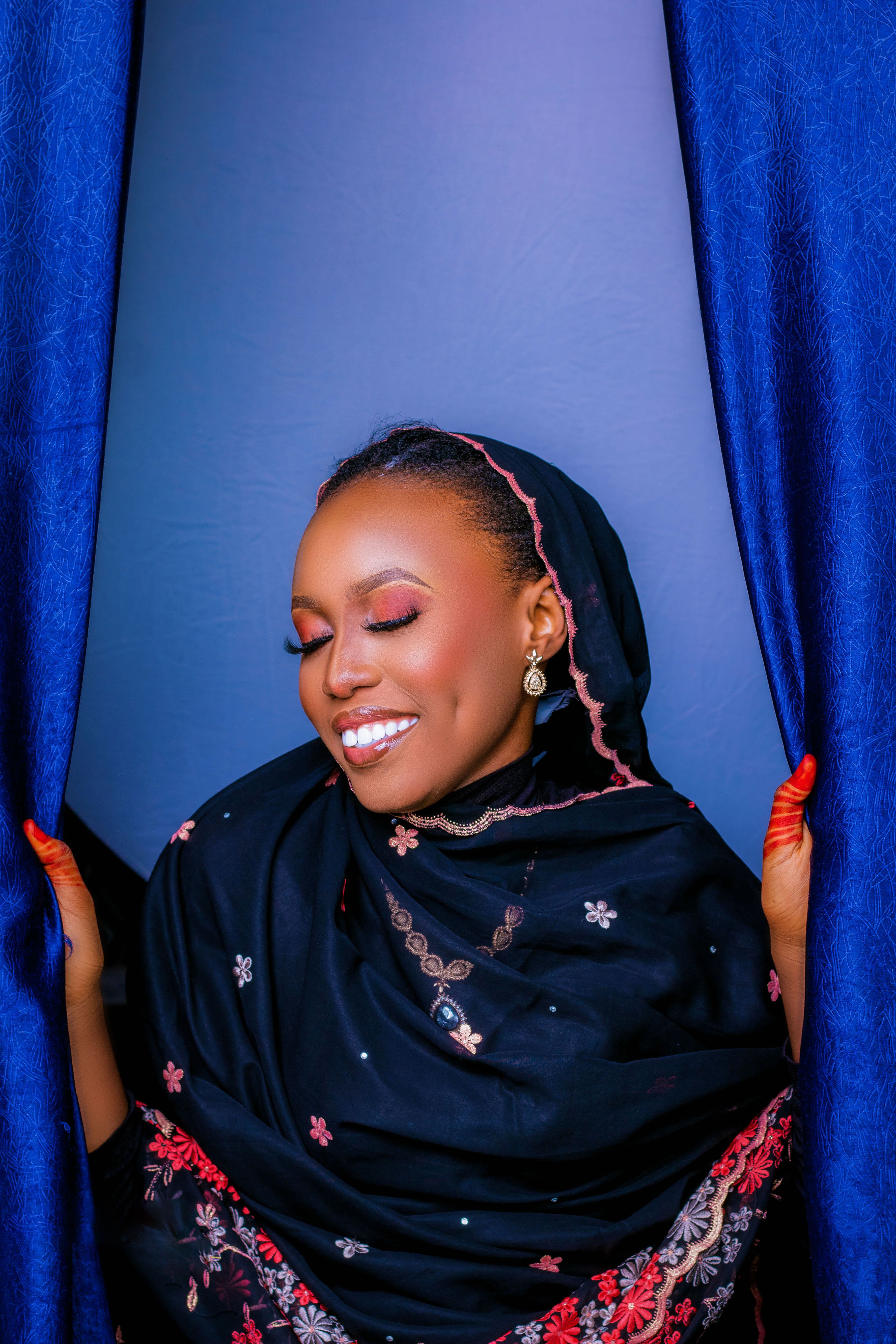 Elegant Woman in Traditional Attire Smiling · Free Stock Photo
