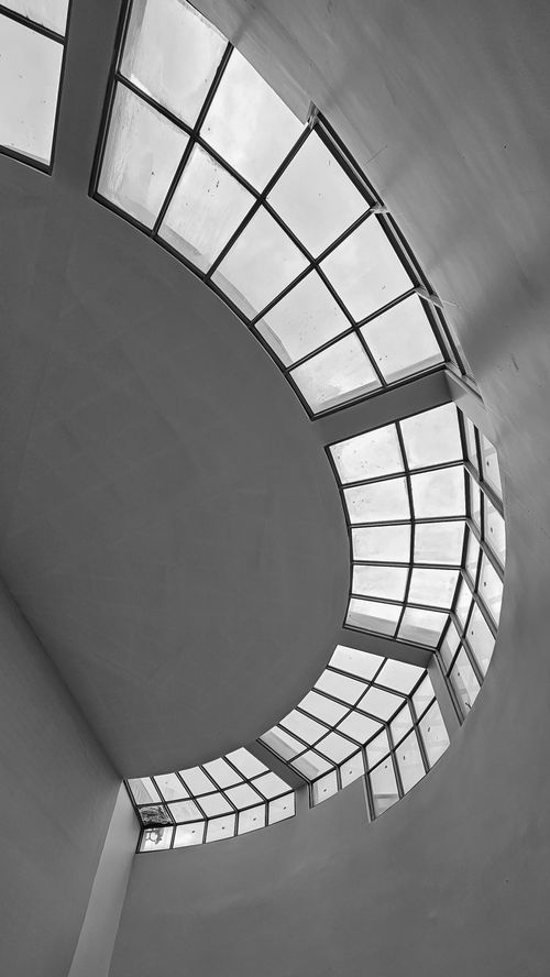 Free Black and white abstract view of the Guggenheim Museum interior spiral walkway ceiling. Stock Photo