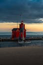 Dusk Sailing by Holland's Iconic Red Lighthouse