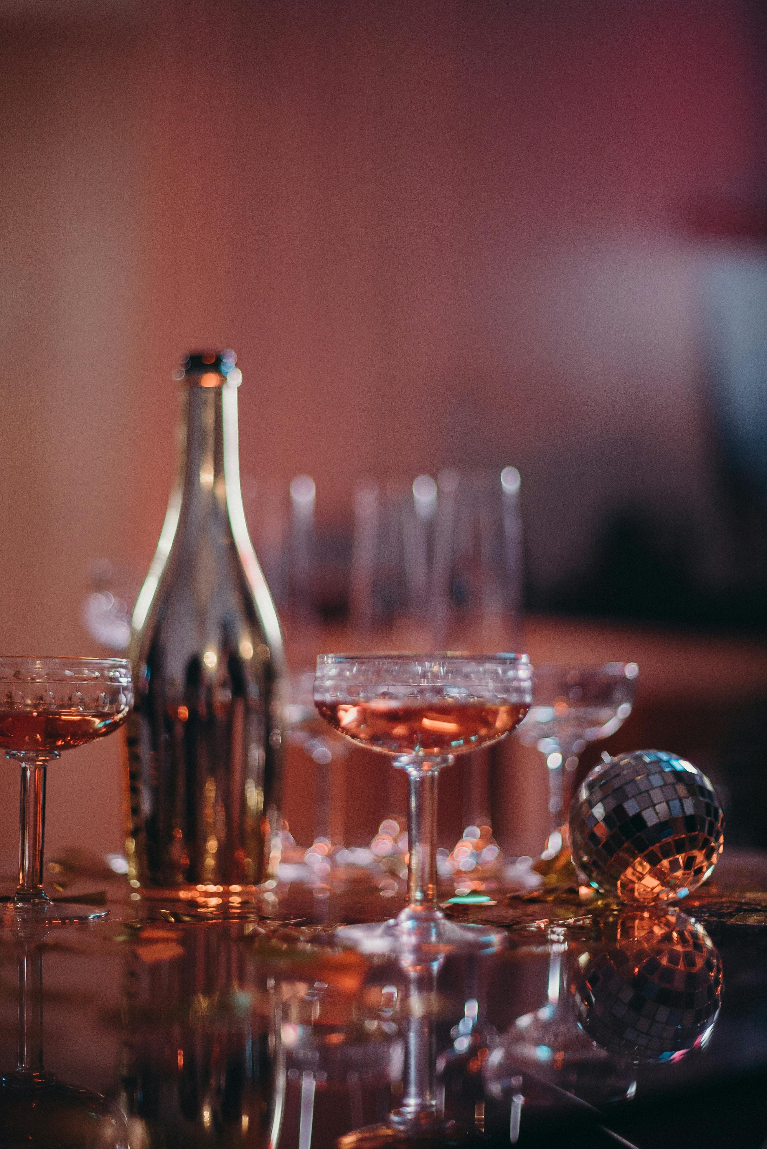 Assortment of Liquors Displayed on Shelves in a Bar · Free Stock Photo