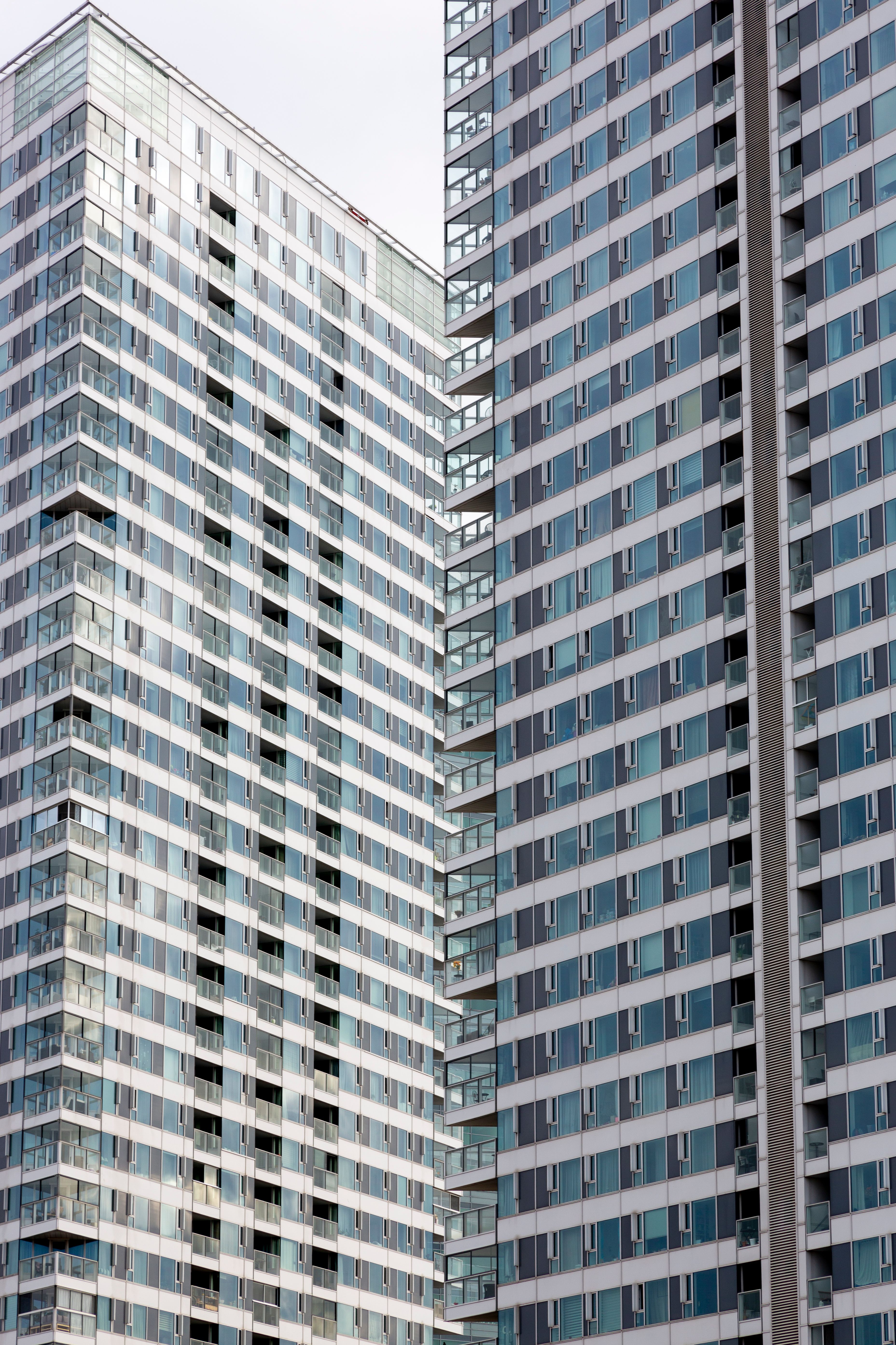 Urban Traffic Light Hanging Near High-rise Apartments · Free Stock Photo