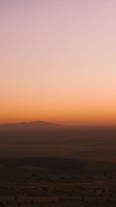 Serene Sunset Over Rolling Hills Landscape · Free Stock Photo