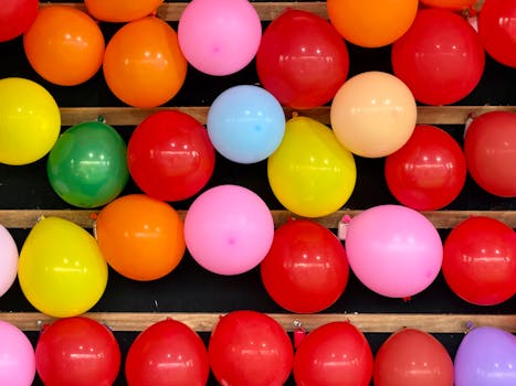 Bright and festive display of colorful balloons at an amusement park in Ascot Vale, Australia.
