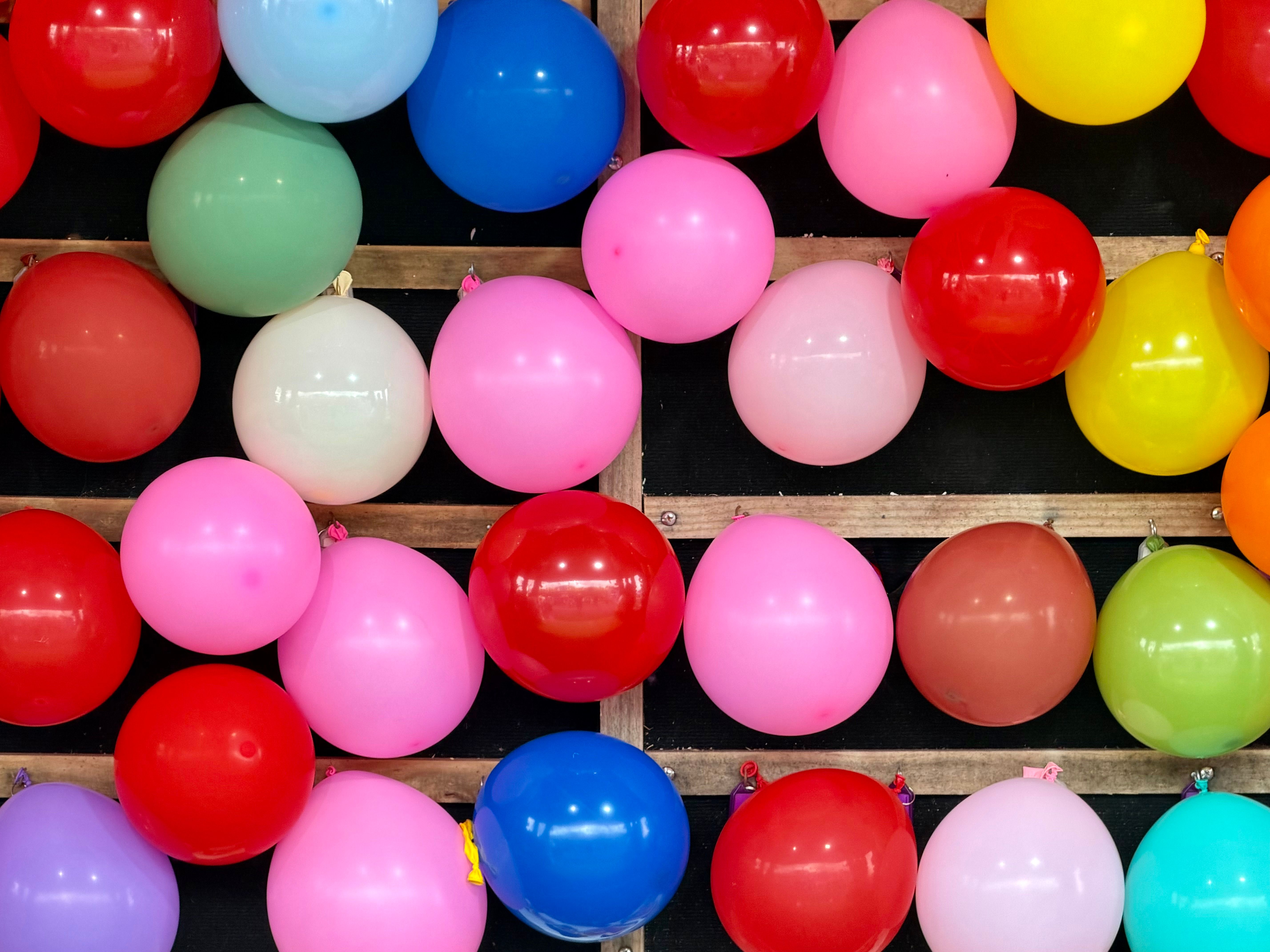 carnival games rental cairo — Vibrant balloons at a funfair stall, creating a cheerful atmosphere in Ascot Vale, Australia.