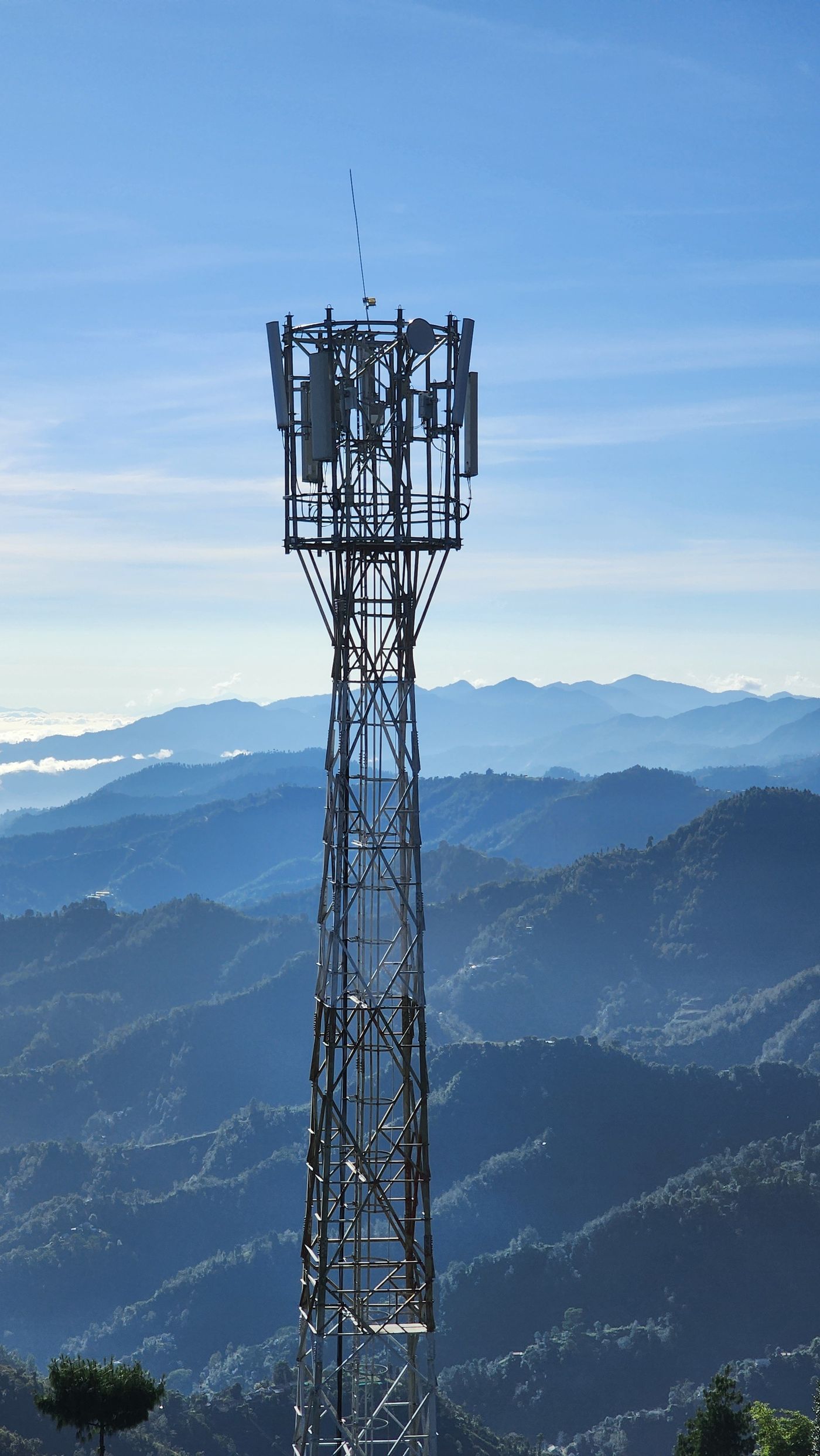 Telecom tower against a mountain landscape