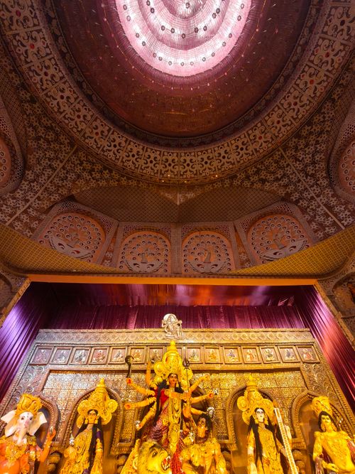 Free Intricate decorations of a Durga Puja pandal showcasing traditional Indian art and culture in Kolkata. Stock Photo
