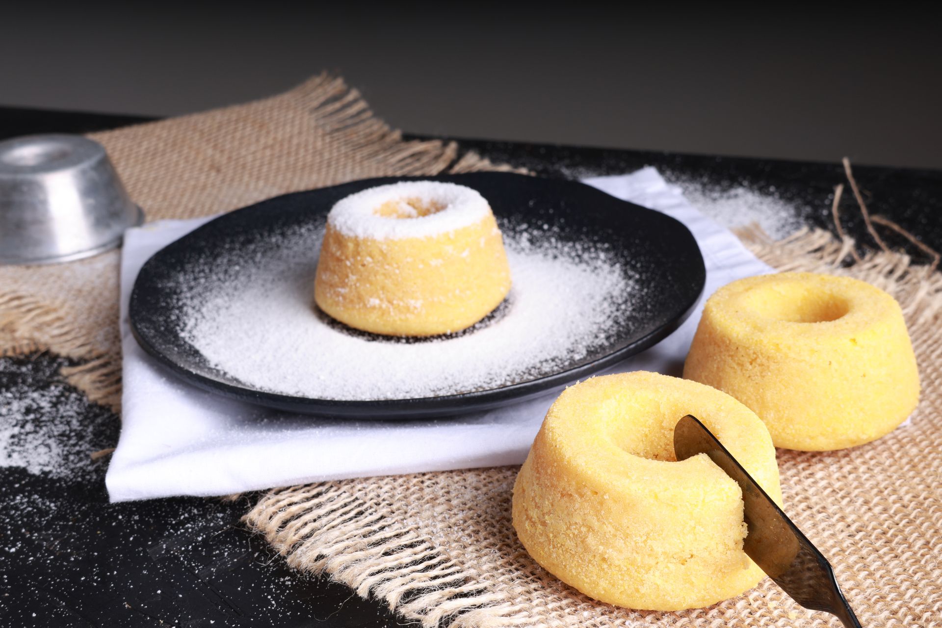 Savor the sweetness of homemade mini bundt cakes topped with powdered sugar icing.